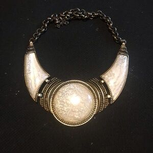 Large white and gold necklace.
